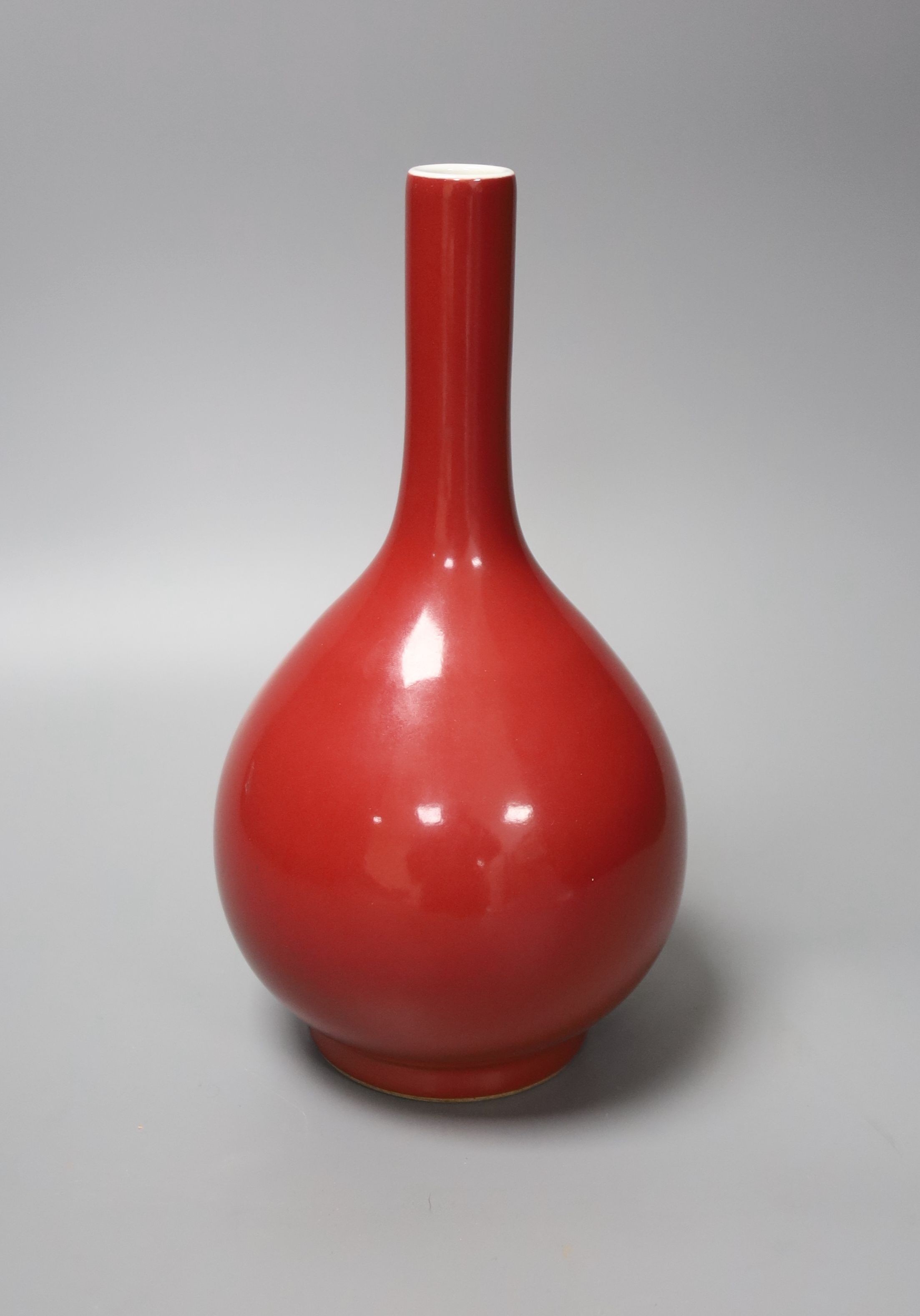 A Chinese red ground bottle vase, Qianlong mark but later 25cm